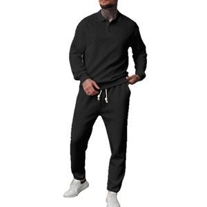 Men's black long sleeve knit polo set with textured pattern and drawstring trousers