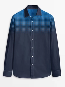 Detail of navy blue men's shirt showing the gradient polka dot print and button collar