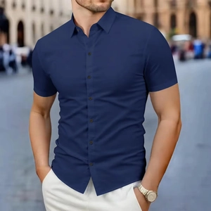 Detail of navy blue slim fit short sleeve shirt with button-down collar and smooth fabric