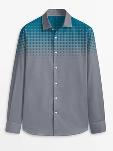 Detail of teal polka dot gradient pattern and white buttons on men's long sleeve shirt