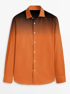 Detail of the shirt collar and black polka dot gradient on bright orange fabric