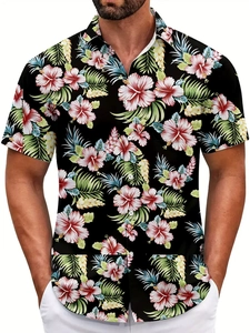 Detail of red hibiscus and green tropical floral print on a black men's beach shirt