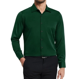 Detail of dark green men's long sleeve shirt showing buttoned chest pocket and silky fabric