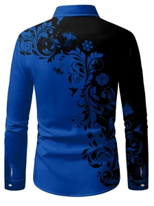 Detailed view of the back of a blue and black long sleeve shirt with floral vine patterns