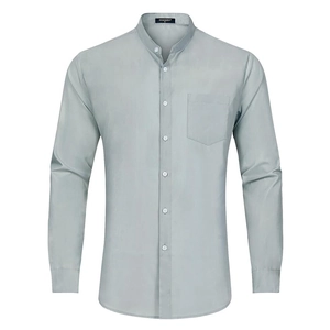 Detailed view of mandarin collar and chest pocket on light gray long sleeve shirt