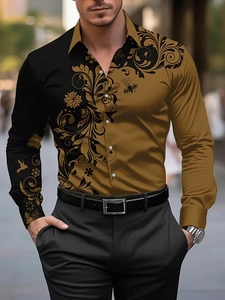 Detailed close-up of gold baroque patterns on a black long sleeve shirt for men
