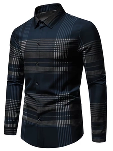 Detailed close-up of geometric patchwork and digital print on navy blue men's shirt