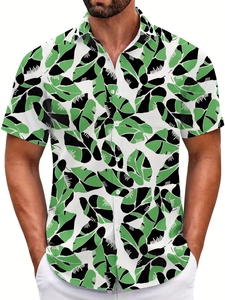 Detail of tropical leaf print and white button closure on men's short sleeve beach shirt