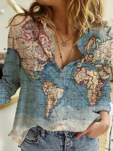 Detailed view of the vintage world map print and classic collar on this long sleeve shirt