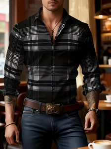 Detail of slim fit men's long sleeve shirt featuring a classic black and white tartan pattern