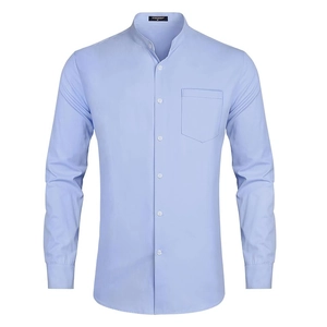 Detail of light blue band collar shirt featuring a functional chest pocket and white buttons