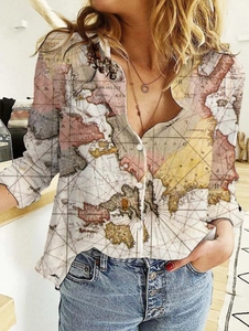 Detail of long sleeve shirt featuring vintage world map print and classic button closure