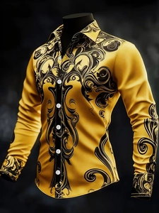Detailed view of luxury gold satin shirt with black baroque scroll print and classic collar