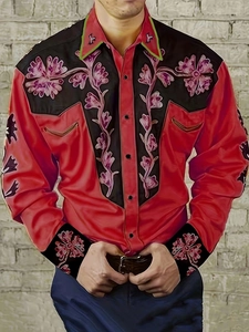 Detail of western retro men's long sleeve shirt with floral embroidery and red fabric
