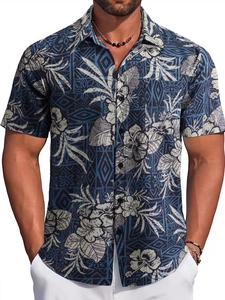 Detail of blue Hawaiian shirt featuring tropical floral patterns and standard collar
