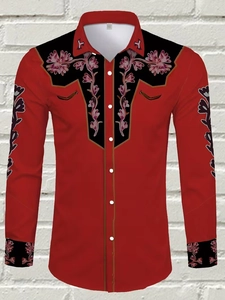 Detail of red men shirt with western floral embroidery on black chest panels and cuffs