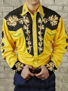 Detail of western cowboy style yellow shirt with floral embroidery on black panels