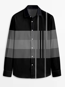 Close-up of men's black long sleeve shirt with grey geometric patterns and buttoned collar