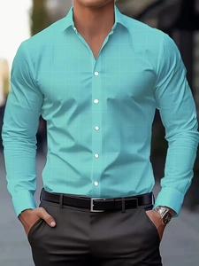 Detail of teal long sleeve slim fit shirt featuring subtle checkered texture and white buttons