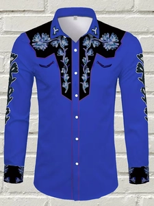 Detail of royal blue men's western shirt featuring black floral embroidery on shoulders