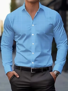 Detail of light blue slim fit dress shirt with white square pattern and button-down collar