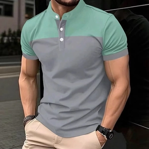 Detail of men's polo shirt featuring mint green and grey color block with three buttons