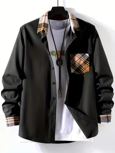 Detail of men's black shirt with yellow checkered collar, cuffs and chest pocket