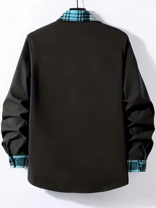 Detail of men's black long sleeve shirt featuring plaid inner collar and cuff lining