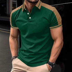 Detail of color-block polo shirt featuring green body, khaki shoulders and striped cuffs