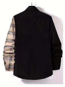 Detail showing the contrast stitching of black fabric and beige plaid sleeve on shirt