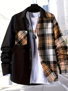 Detail of men's long-sleeve shirt showing asymmetrical black and brown plaid patchwork design