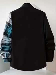 Detail showing contrast plaid sleeve stitching on a black men's long-sleeved shirt