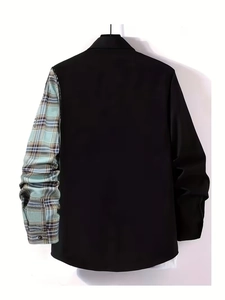 Detailed view of men's long sleeve shirt with asymmetric black body and plaid pattern sleeve