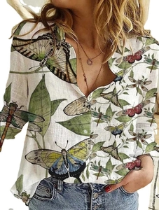 Detailed view of white long-sleeve shirt with vintage butterfly and botanical prints