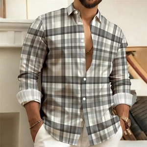Detail of grey gradient plaid long sleeve shirt showing buttoned cuff and lapel collar