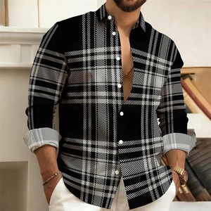 Detail of men's black and white plaid shirt with contrast light gray inner cuffs