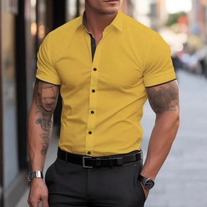 Close-up of yellow slim-fit shirt with black contrast collar and button details