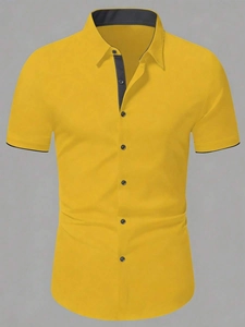 Close-up of yellow shirt collar with dark grey contrast piping and detailed buttons