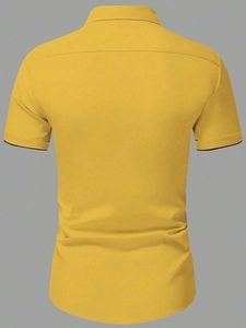 Rear view of men's yellow short-sleeve shirt showing back yoke and black cuff trim details