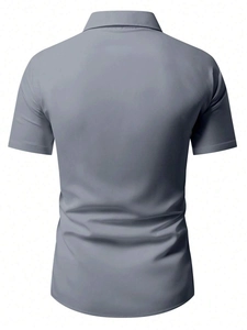 Rear view of men's casual short sleeve grey shirt showing smooth fabric and neat collar