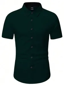 Detail of dark green short-sleeved shirt featuring contrast collar lining and buttons