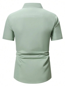 Rear view of a mint green short-sleeve shirt showing smooth fabric and slim fit tailoring