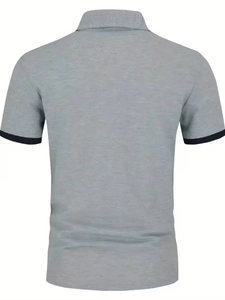 Rear view of a grey short-sleeve polo shirt with contrasting navy blue ribbed sleeve cuffs