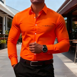 Detail of slim-fit orange men shirt featuring black script logo and white buttons on the chest