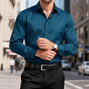 Detail of teal long sleeve slim fit men shirt with classic collar and matte buttons