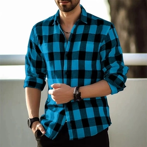 Detail of men's slim fit blue and black plaid shirt with rolled sleeves and classic collar