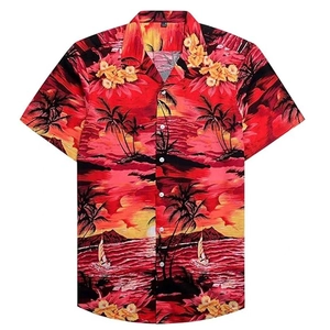 Detail of tropical sunset print on men short sleeve shirt with palm trees and sailboats