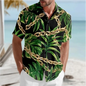 Detail of tropical palm leaf and gold chain print on slim-fit summer beach shirt