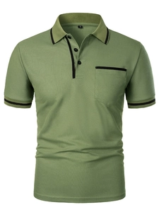 Detail view of olive green polo shirt with black contrast trim on collar and pocket