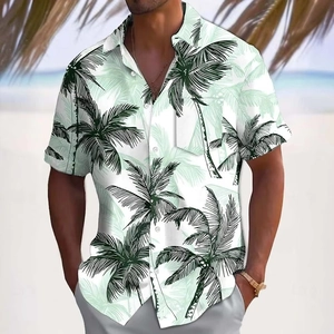 Detail of tropical palm leaf print on white men's short sleeve summer Hawaiian shirt
